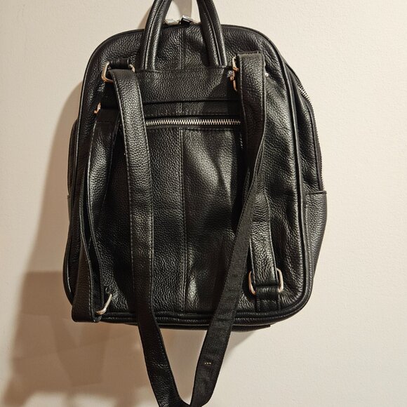 Roma black backpack. Very roomy, zipper closure